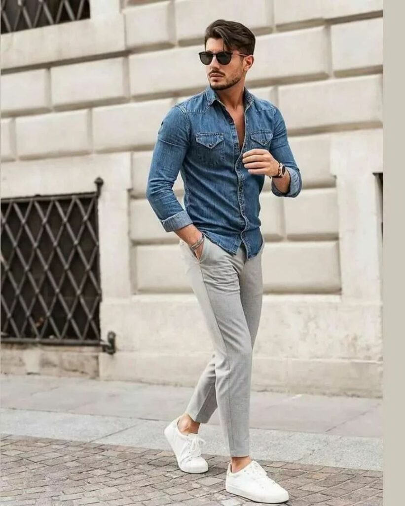 A blue jean jacket with gray trousers