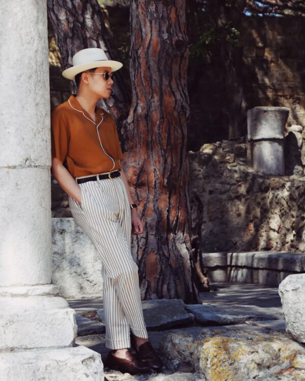 Striped pants with a red shirt.