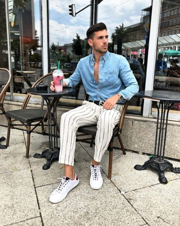 A blue denim shirt with white pinstripe pants.