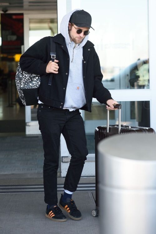 Robert Pattinson's street style with a baseball cap